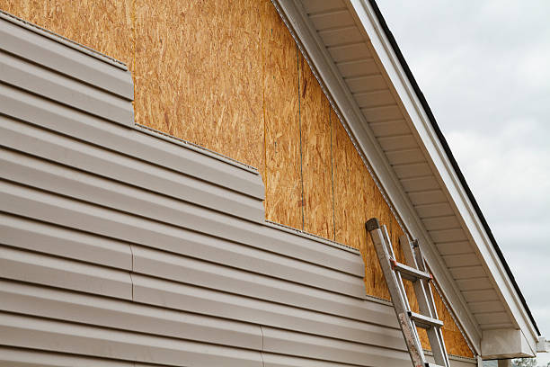 Professional Emergency Siding Repair technician working in Amsterdam, OH